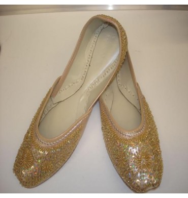 Gold sequined flat shoes
